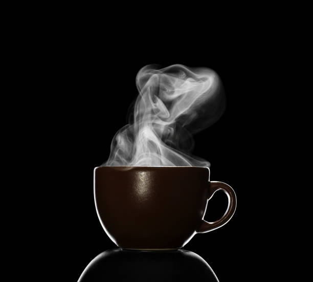 istock Cup with hot drink, steam over Cup, isolated on black 997533692