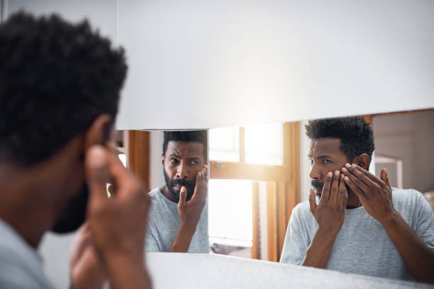 istock Keeping an eye on his skin 997536038