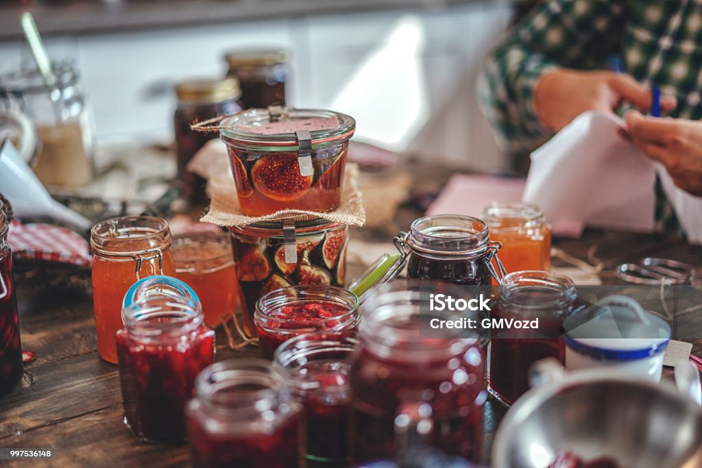 Preparing Homemade Strawberry, Blueberry and Raspberry Jam and Canning in Jars Preserves Stock Photo