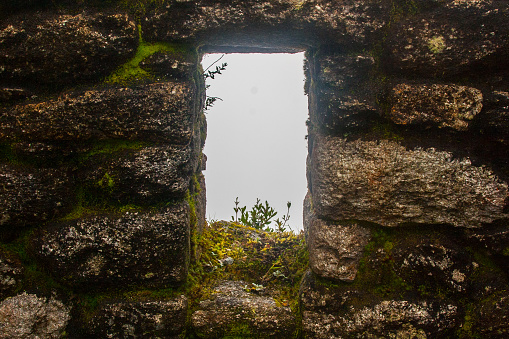 Window on a stone wall in a Inca ruin along the Inca Trail. Cuzco. Peru. South America. No people.