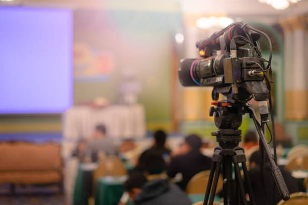 istock Video camera taking live video streaming with people working background at meeting room. 997539978