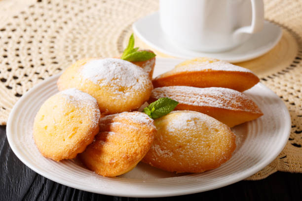 istock Beautiful pastry Madeleine with mint and tea close-up. horizontal 997545448