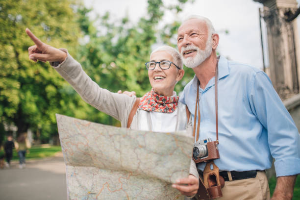 istock Elderly woman pointing direction to her husband 997548838