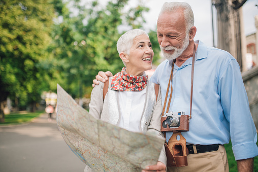 Couple in love using touristic map together