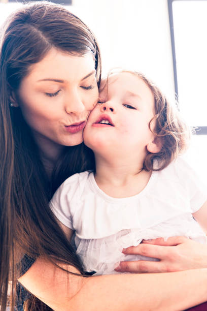 istock Mother and Daughter Cuddling each other with Love 997554606