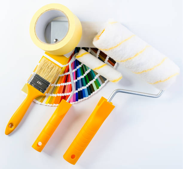 istock Paintbrush, paint rollers, adhesive tape and colorful paint samp 997558376