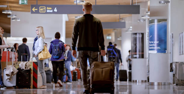 istock Business people at airport 997558776