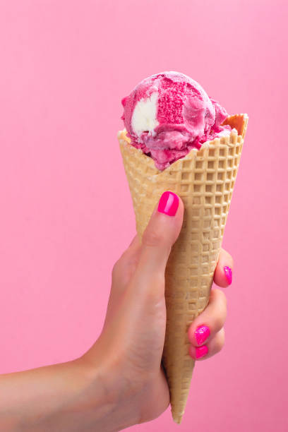 istock Woman hand holding ice cream 997562738