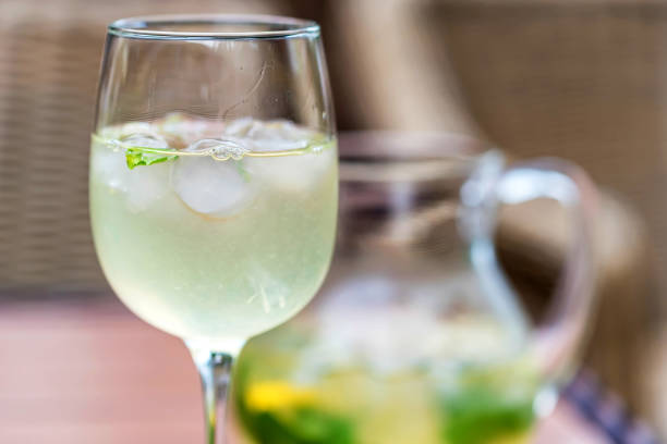 istock Refreshing Mojito cocktail in glass and jug close 997567356