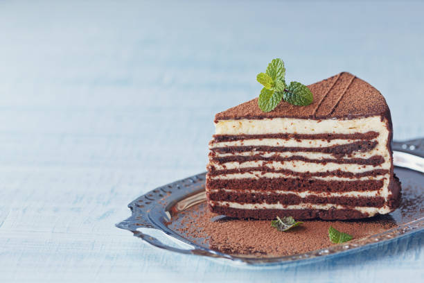 istock Slice of delicious chocolate cake on silver plate 997579596