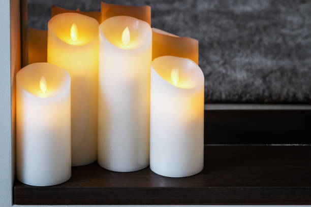 led electric candles stand in the home stock photo
