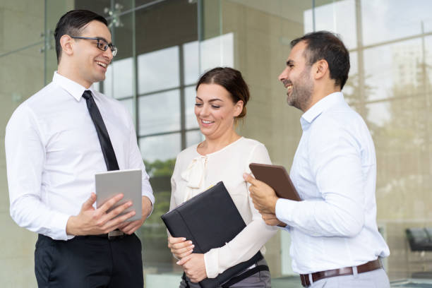 istock Cheerful coworker joking around and laughing during break 997586976
