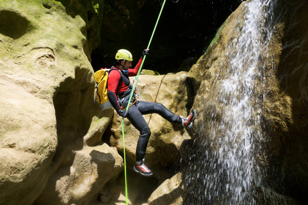 canyoneering in spain - number of people human gender people waterfall imagens e fotografias de stock