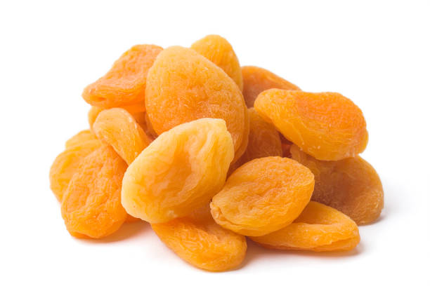 istock heap of dried apricots on white background, isolated 997611970