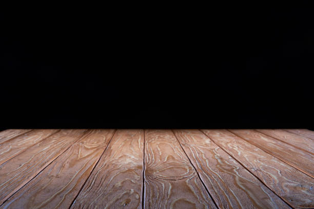 istock empty brown wooden planks surface on black background 997613252