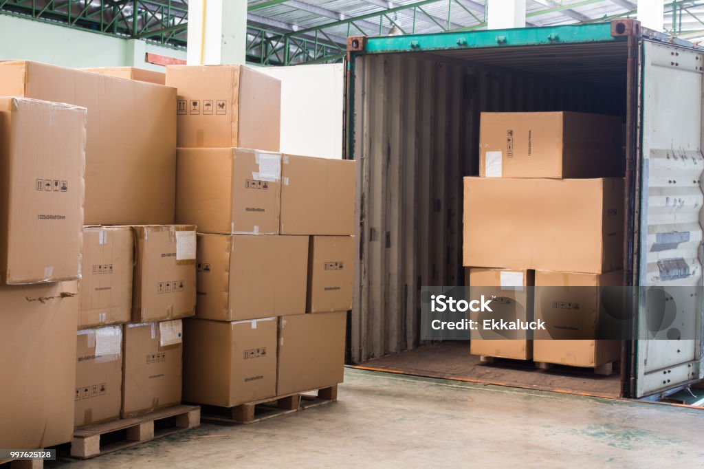 The cartons with loading out of container Truck Stock Photo