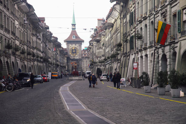 Bern, Switzerland - 12 15 2015: Bern Switzerland old town Kramgasse street Zytglogge clock tower at the end of the street.