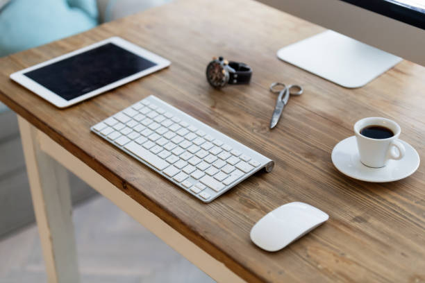 istock Picture of modern office desk with devices 997636408