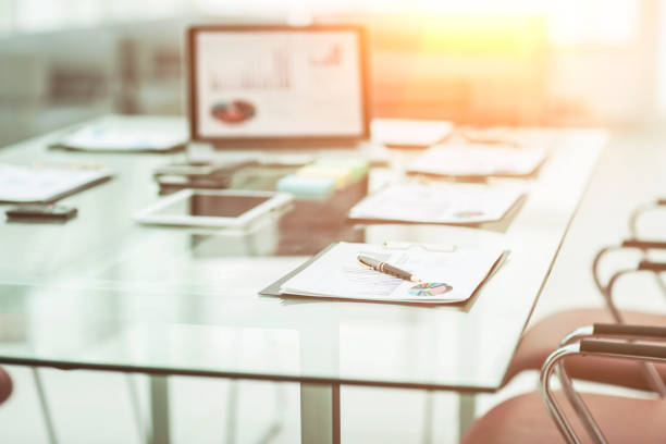 istock workplace with laptop and working documents for the business team in a modern office 997637096