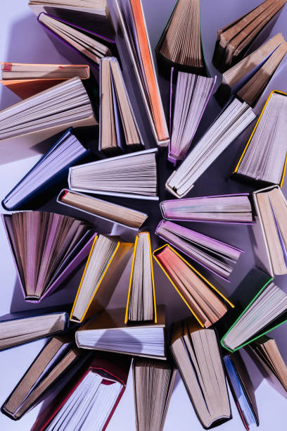 istock elevated view of scattered stack of books on table 997638692