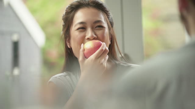 eating apple with someone
