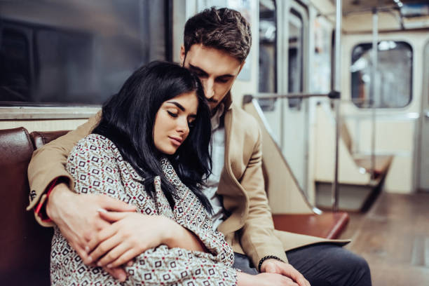 istock Young romantic couple in subway 997648118
