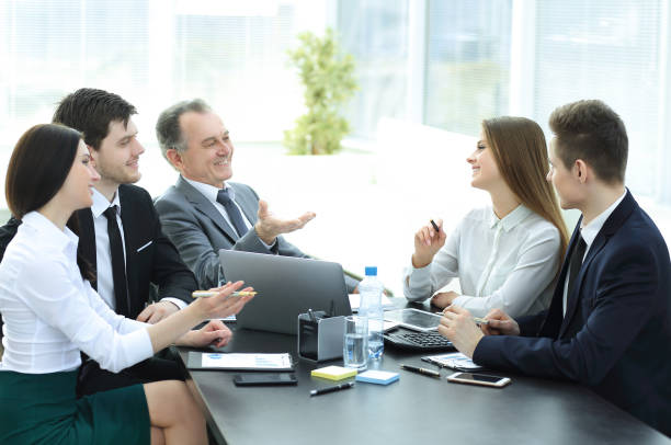 istock business colleagues talking at Desk in the office 997648206