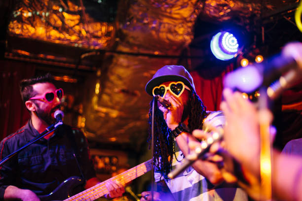 istock Rock music group singing at stage 997655060