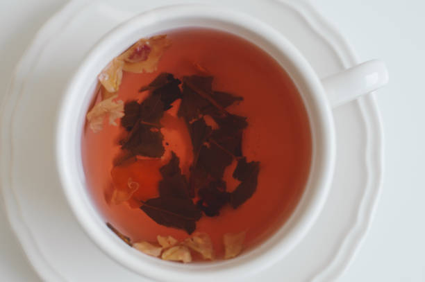 istock Red herbal tea in white cup. Healthy hot drink 997657240