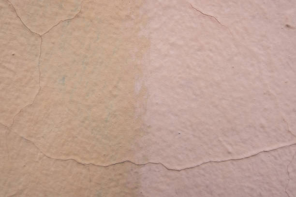 istock Mustard and salmon painted concrete wall. 997657546