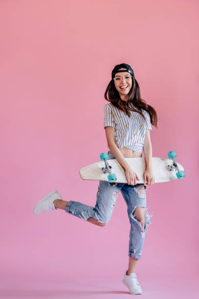 istock Young girl on pink background 997665942
