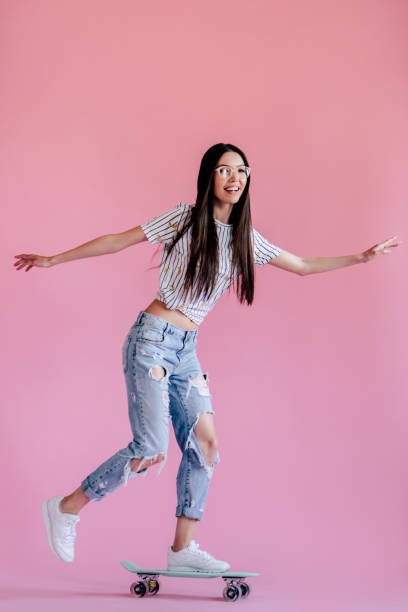 istock Young girl on pink background 997665950