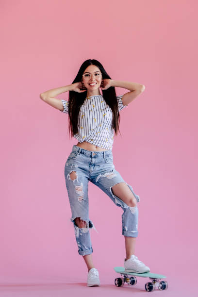 istock Young girl on pink background 997666064