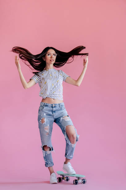 istock Young girl on pink background 997666068