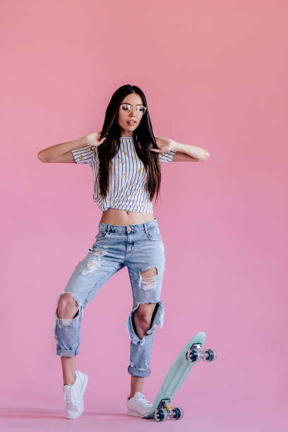 istock Young girl on pink background 997666074