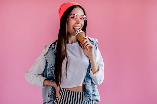 istock Young girl on pink background 997666256
