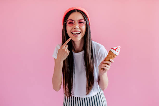 istock Young girl on pink background 997666310
