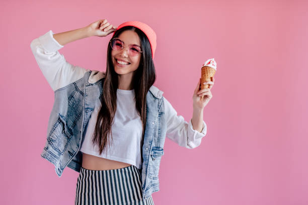 istock Young girl on pink background 997666436