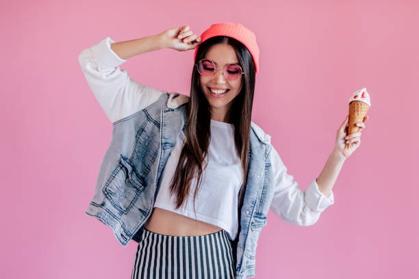 istock Young girl on pink background 997666438