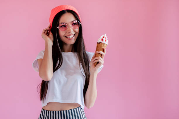 istock Young girl on pink background 997666442