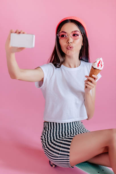 istock Young girl on pink background 997666988