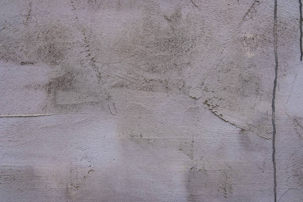 istock Grunge urban white concrete wall with scratches. 997667364