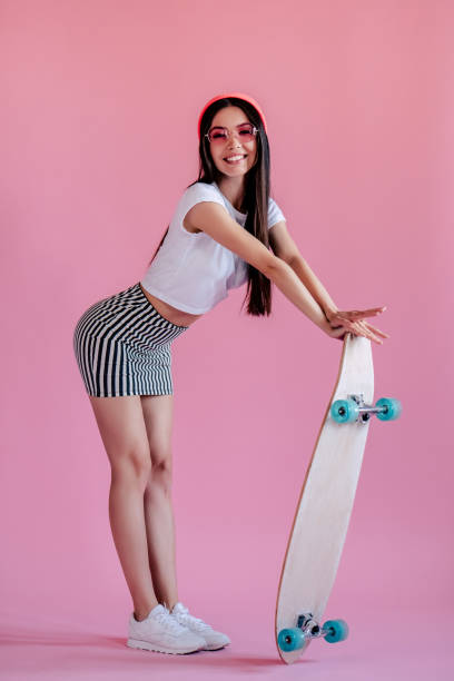 istock Young girl on pink background 997667692