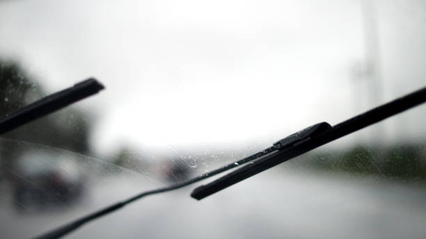istock Car windshield wipers in the rainy weather 997673924