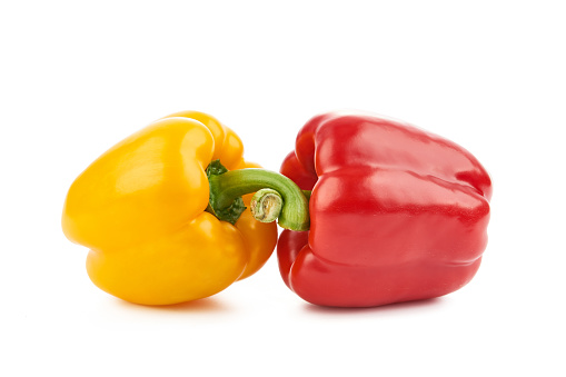 Yellow and red peppers on a white background