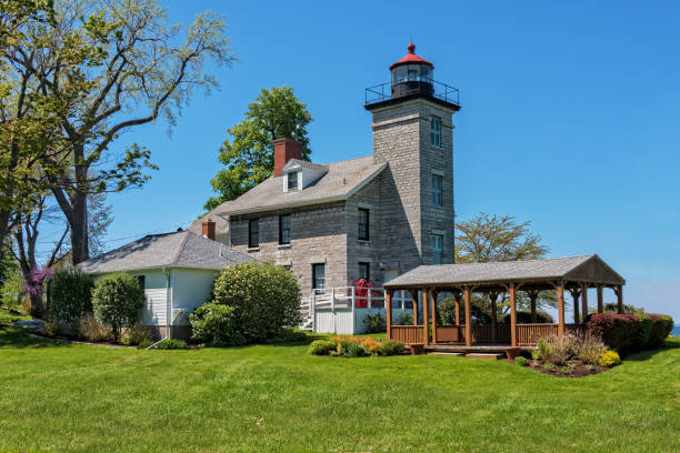 Sodus Point Lighthouse And Museum On Lake Ontario Sodus Point, NY - May 21, 2018: Sodus Point Lighthouse and Museum in Sodus Point New York On Lake Ontario rochester new york state stock pictures, royalty-free photos & images