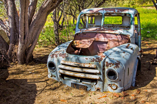 istock Wrecked and abandoned old blue truck 997685646