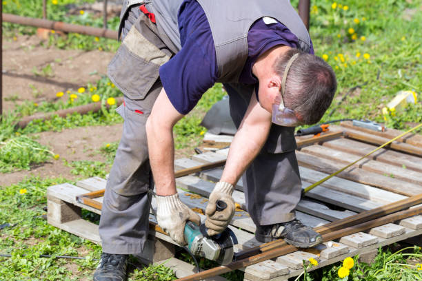 istock The worker cuts a piece of iron with an angle grinder 997686170