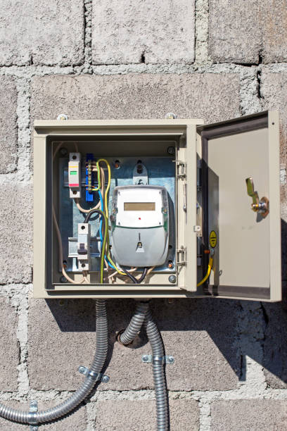 istock The electricity meter in a protective metal casing on a stone wall 997686628