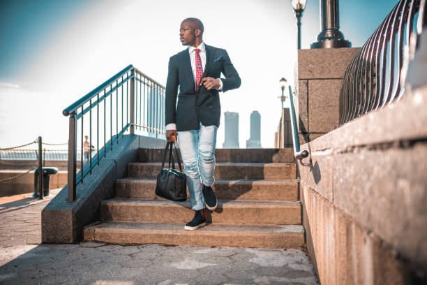 istock Businessman walking down the staircase 997694758
